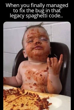 Baby covered in spaghetti sauce with a satisfied expression