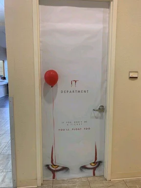 IT department door with a red balloon and a threatening message
