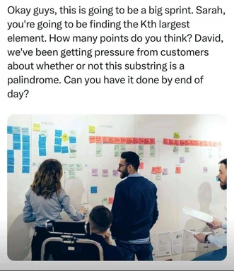 A group of developers discussing a project on a whiteboard covered in sticky notes