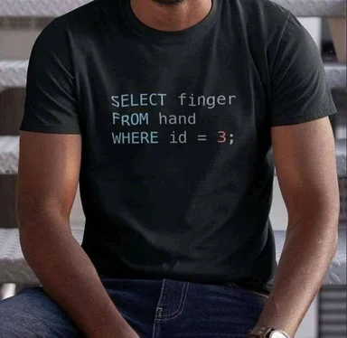 man wearing a black t-shirt with a SQL query on it