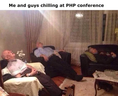 Three men asleep at a conference