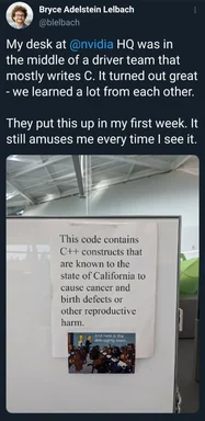 A humorous office sign on a fridge with a Simpsons meme about C++ code health warnings