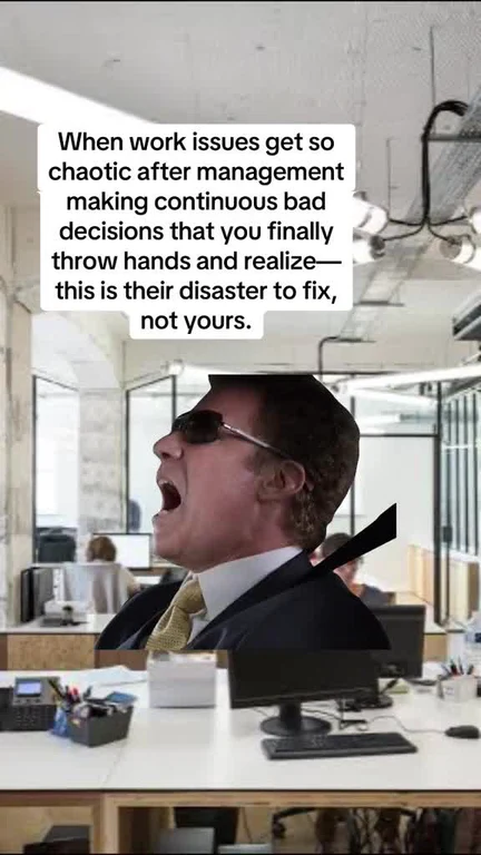 Man in office throwing hands up in exasperation