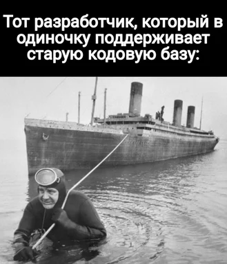 a man in a wetsuit and goggles in the water with a large ship in the background