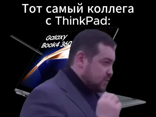 Man in a suit with a fist in front of laptops