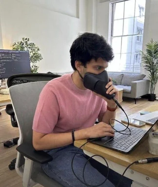 programmer with a hair dryer on their face
