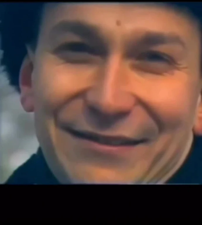 Smiling man with closed eyes