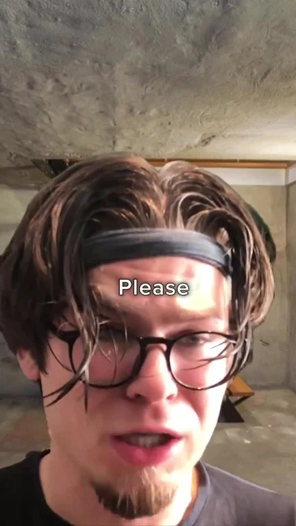 A man with a pleading expression and messy hair