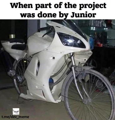 a white motorcycle with a bicycle attached to it