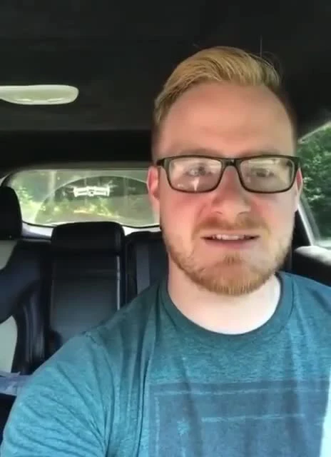 man in car talking