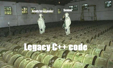 Two hazmat-suited developers standing in a warehouse full of barrels labeled Legacy C++ code