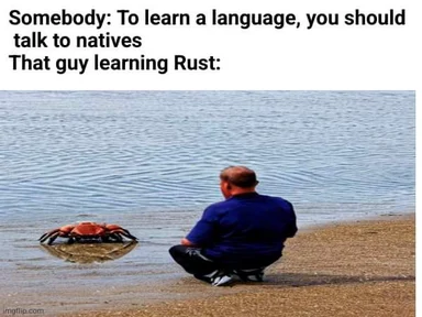 man sitting on beach talking to crab