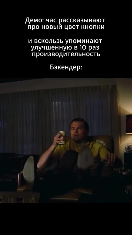 man sitting on a couch with a can, looking unimpressed
