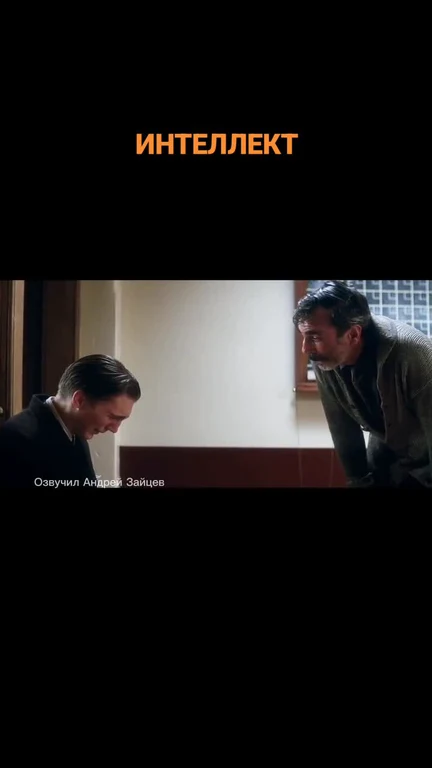 Two men looking at each other with a serious expression