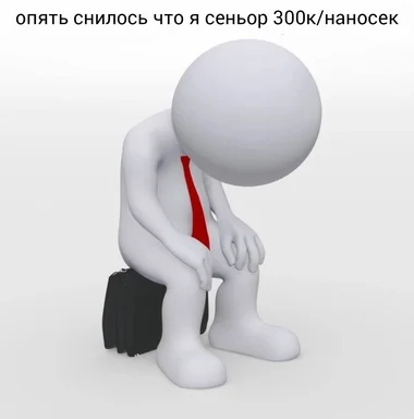 a white manikin wearing a red tie sitting on a briefcase with a dejected expression