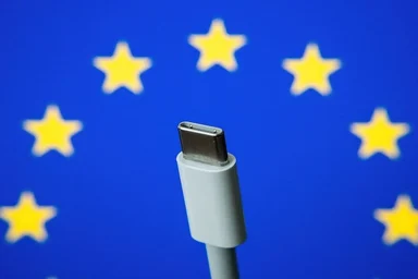 European Union flag background with USB-C cable
