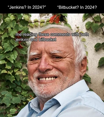 Smiling older man looking surprised reading comments about jenkins and bitbucket
