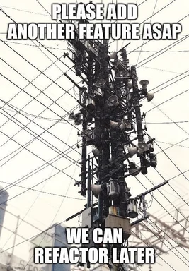 overloaded electrical tower with many wires and devices