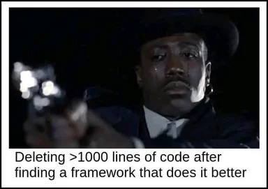Sad man in a suit and hat crying while holding a gun, with text about deleting code