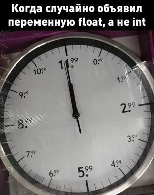 a clock with a white face and black numbers and hands