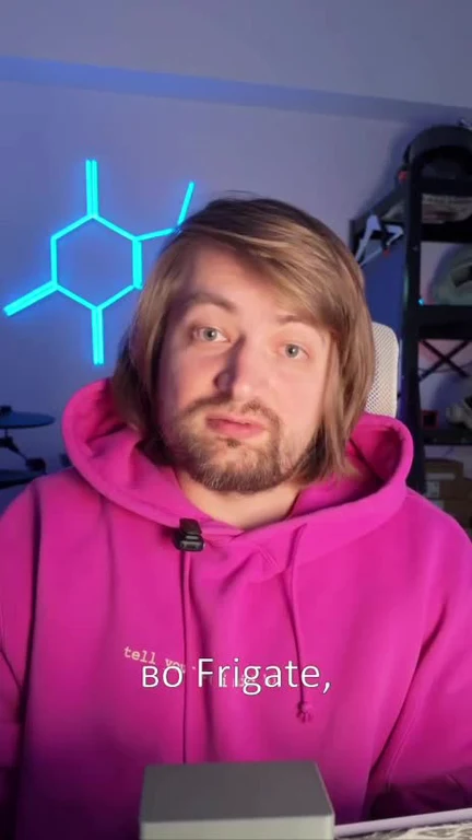 Man in pink hoodie with a surprised expression and text 'tell BØ Frigate'