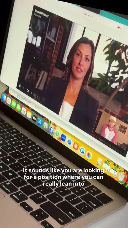 A laptop screen showing a video call with a recruiter named Dana Whitfield saying 'It sounds like you are looking for a position where you can really lean into'.