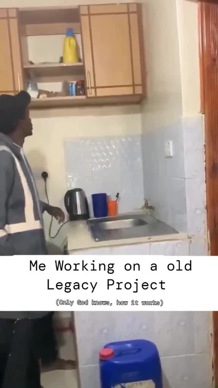 man in kitchen looking at sink with text 'Me Working on a old Legacy Project (Only God knows, how it works)'