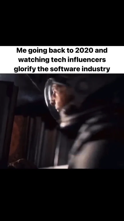 Nostalgic tech worker looking back at past tech influencer content