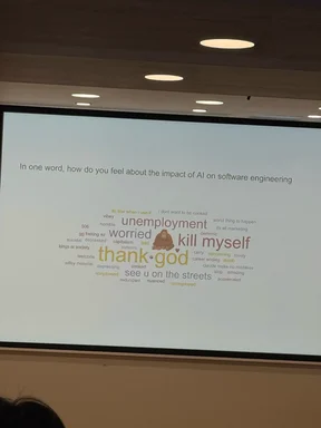 Projected slide showing a word cloud of developer reactions to AI's impact on software engineering