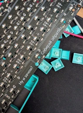Russian meme of a keyboard circuit board with scattered keys and humorous text