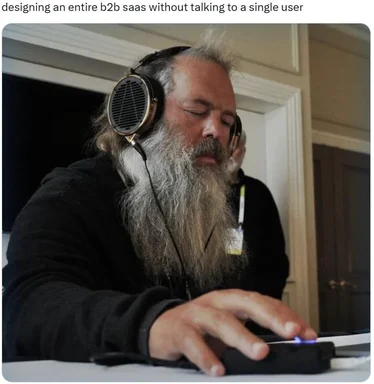 man in headphones designing b2b saas without user research