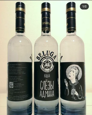 Three bottles of Beluga vodka with custom labels