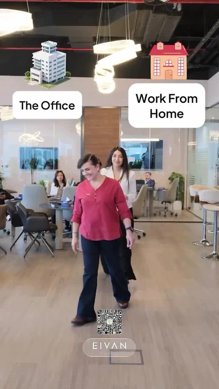 a woman walks through an office to a home
