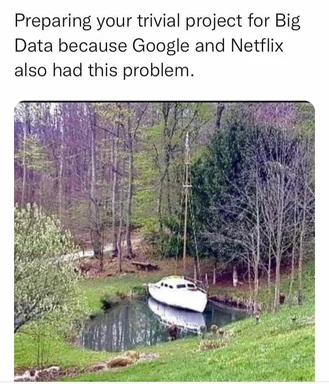 a white boat sits in a small pond surrounded by trees