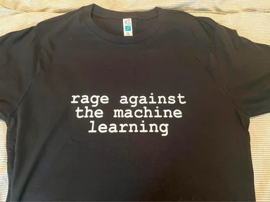 black t-shirt with white text 'rage against the machine learning'