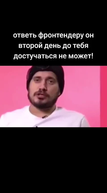 man in white shirt and black hat looking surprised