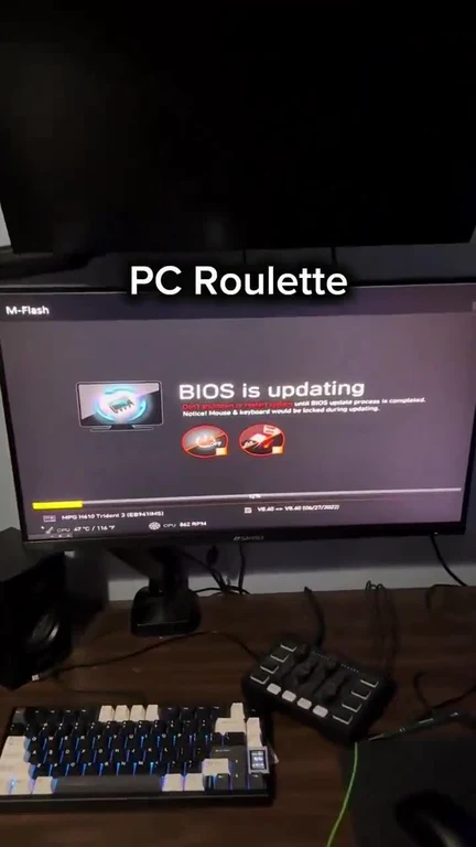 PC Roulette meme with a monitor displaying a BIOS update screen