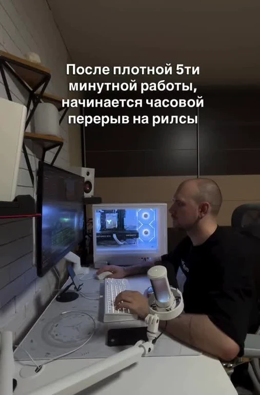 Man taking a break at computer desk
