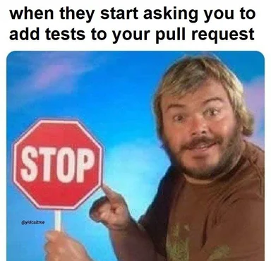 a man holding a stop sign with a smug expression