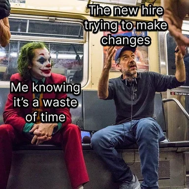 Joker and man on a subway reacting to a new hire trying to make changes