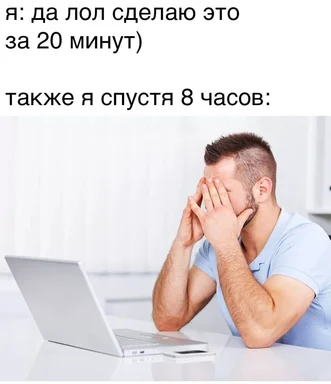 Man sitting at desk with laptop, rubbing temples in frustration