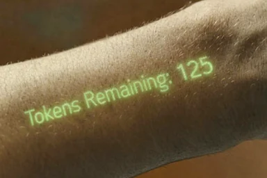 Close-up of an arm with green glowing text projected onto it reading 'Tokens Remaining: 125'.