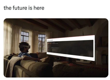 man wearing VR headset sitting on couch with error message on TV screen