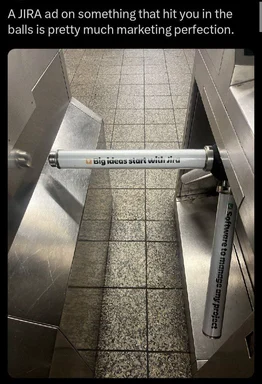 JIRA ad on a protective pipe cover in a doorway with the text 'Big ideas start with Jira'