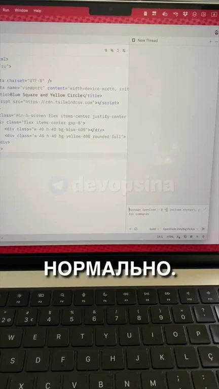 Computer screen with code on it and keyboard with russian text