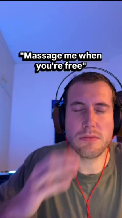 Man in headphones with a caption 'Massage me when you're free'