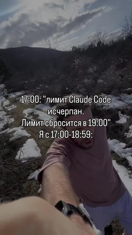 Man in pink shirt holding a device outdoors with snow on the ground