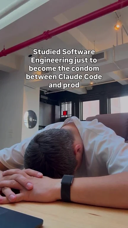 A man sleeping face down on a wooden desk with text overlay about Claude Code and production.