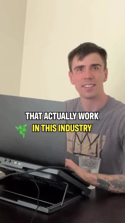 a young man sitting at a desk with a laptop and a surprised expression, with text overlay 'that actually work in this industry'