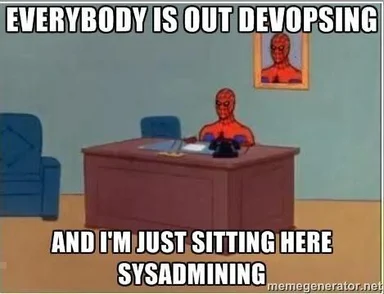 Spiderman sitting at a desk with the caption 'Everybody is out devopsing and I'm just sitting here sysadmining'